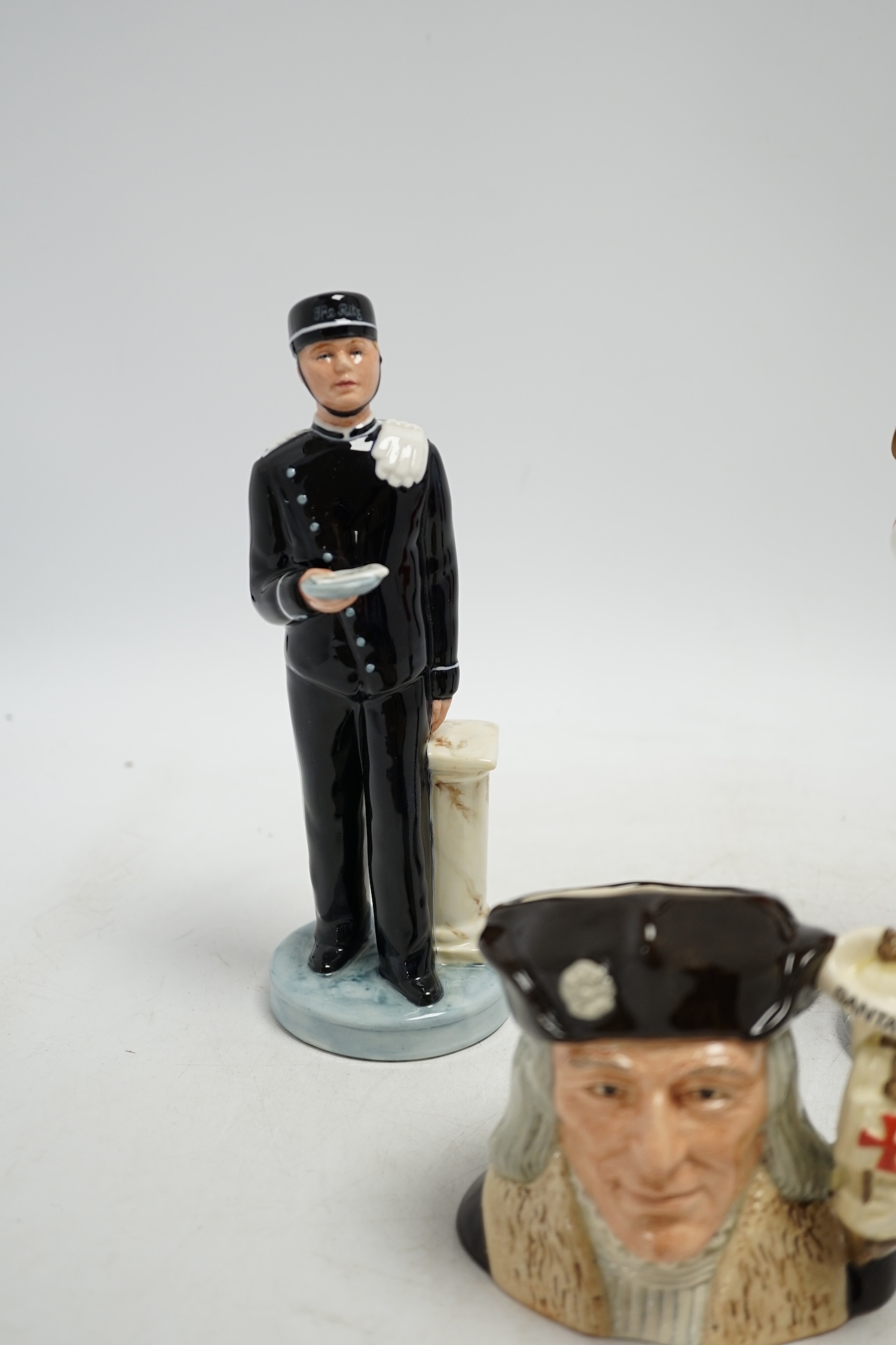 Six Royal Doulton figures including Bunny’s Bedtime, The Guardsman and The Lifeguard, together with a Christopher Columbus Toby jug, all boxed, Guardsman 25cm high. Condition - fair to good